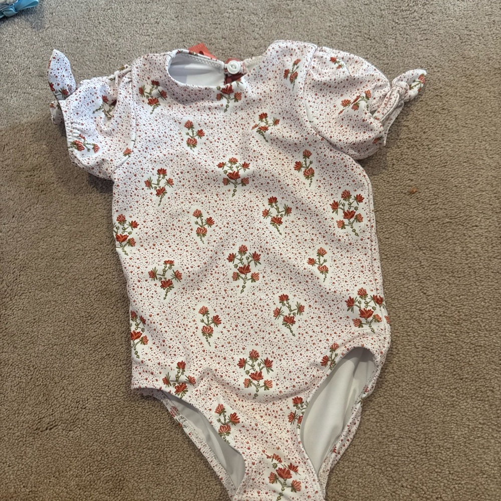 Minnow Swimsuit - red and white floral. Adorable puff sleeves!